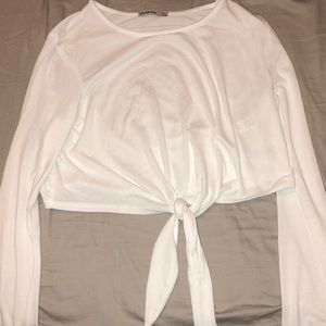 long sleeve cropped top with a tie at the bottom